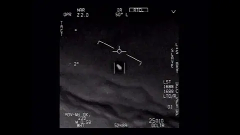 Official DVIDS frame from the GIMBAL UAP video showing a dark object in an infrared targeting display