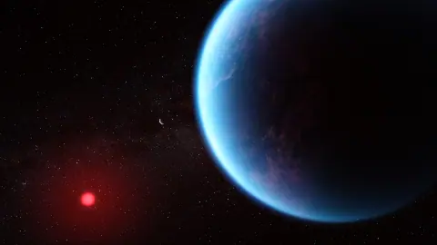 Artist's concept of the blue exoplanet K2-18 b beside its red dwarf star